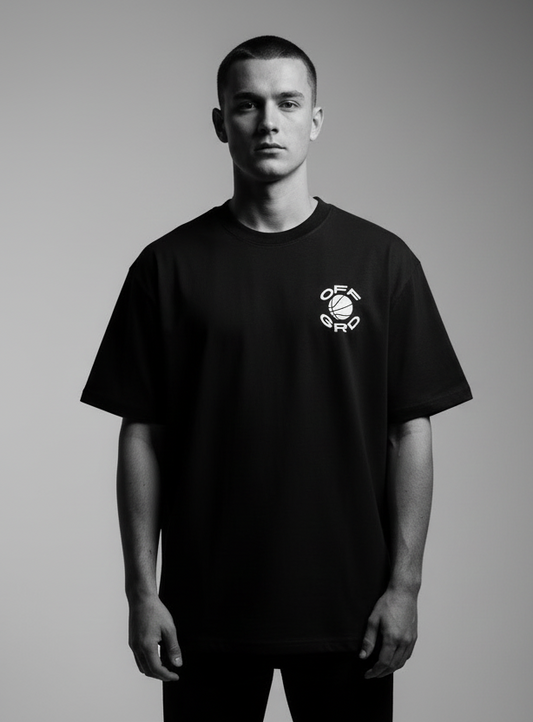 Model wearing OFFGRD Basketball Graphic tee in black, showcasing stylish design for basketball enthusiasts.